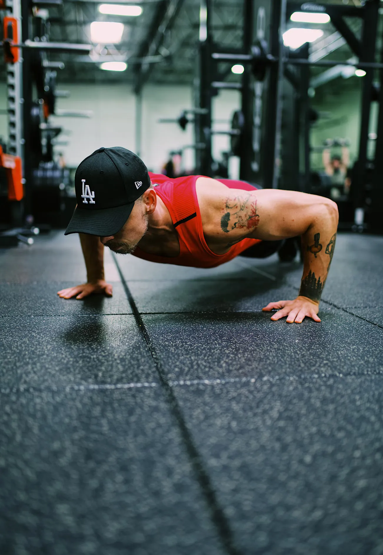 Man doing push ups in a gym